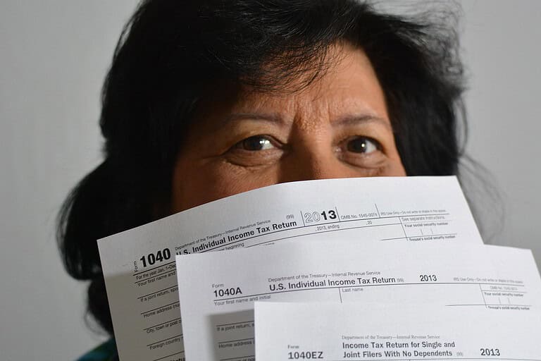 LLC tax concept with forms and calculator